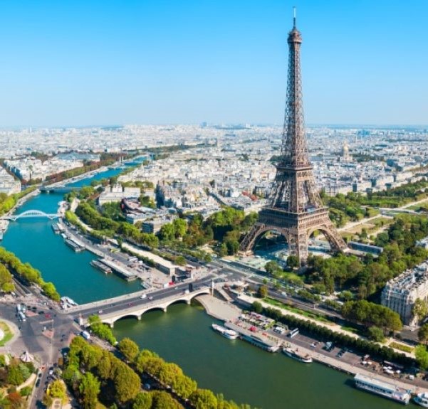 The Seine River flowing through Paris in front of the Eiffel Tower