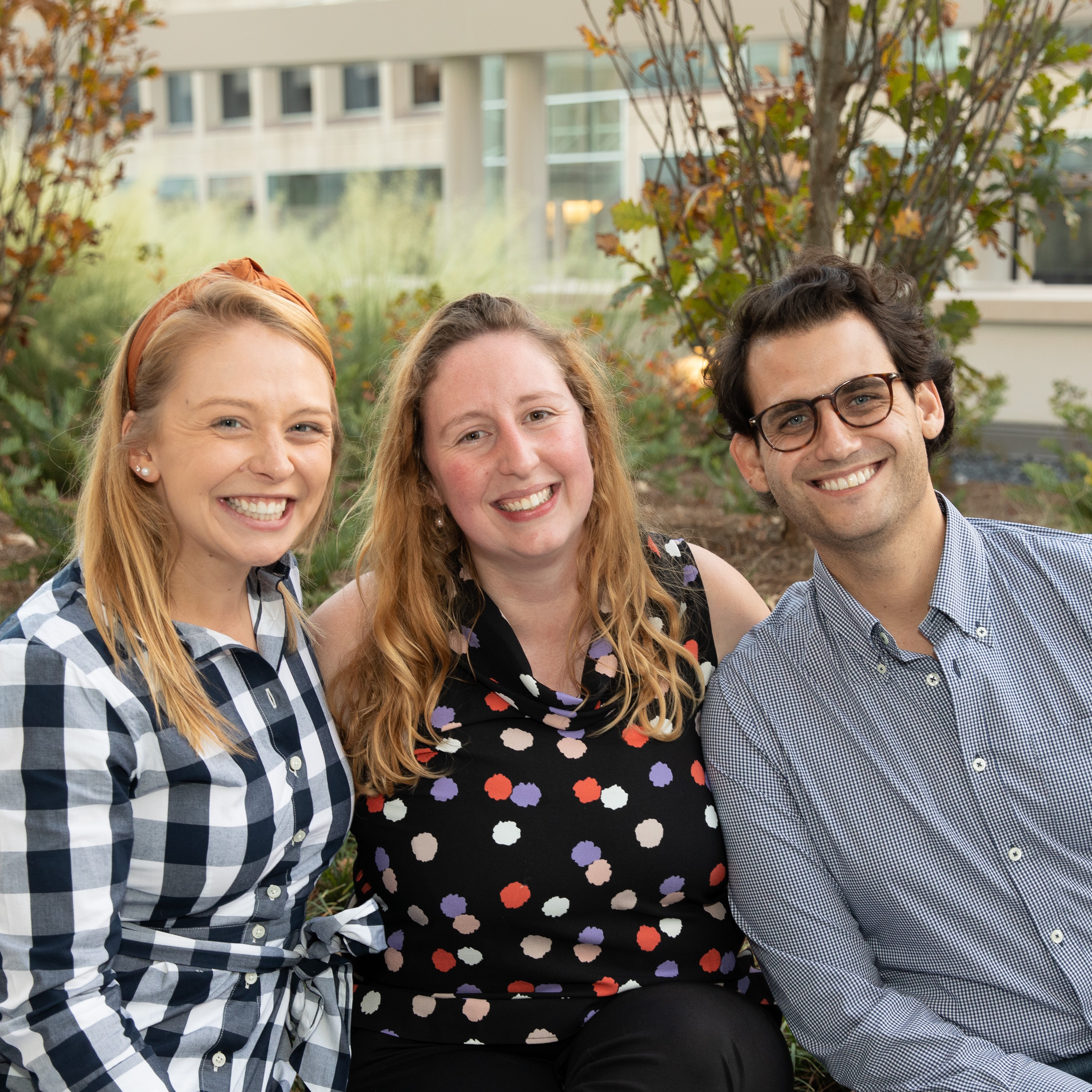 Three alumni at an event.