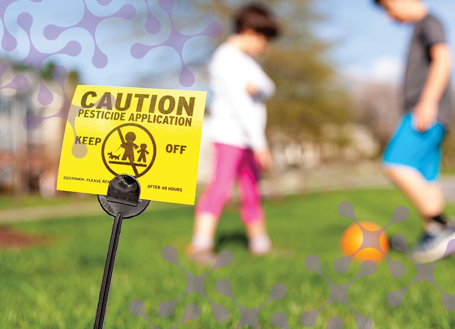 a photo of young kids playing in the grass with a caution sign that reads keep off pesticide application.