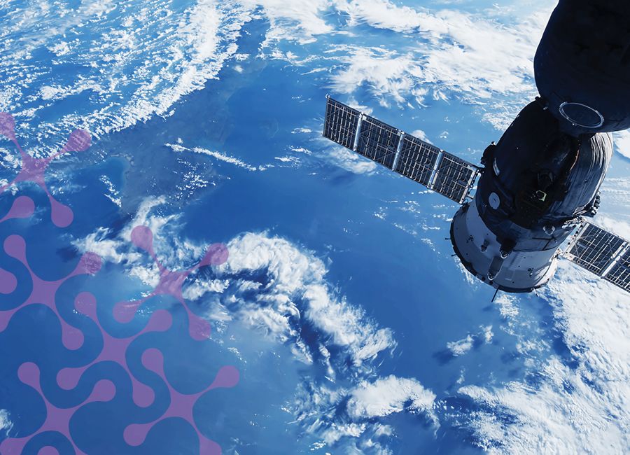 a photograph of a space satellite in space over Earth.