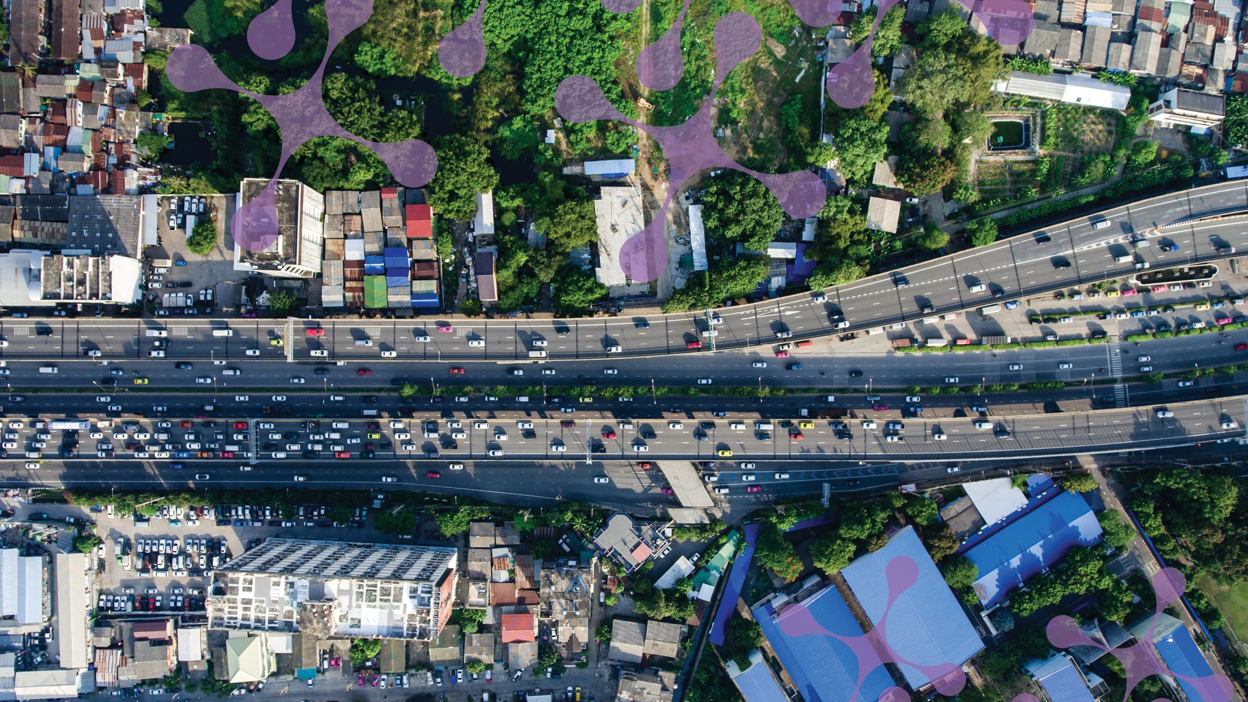 an aerial view of an urban city with major traffic.