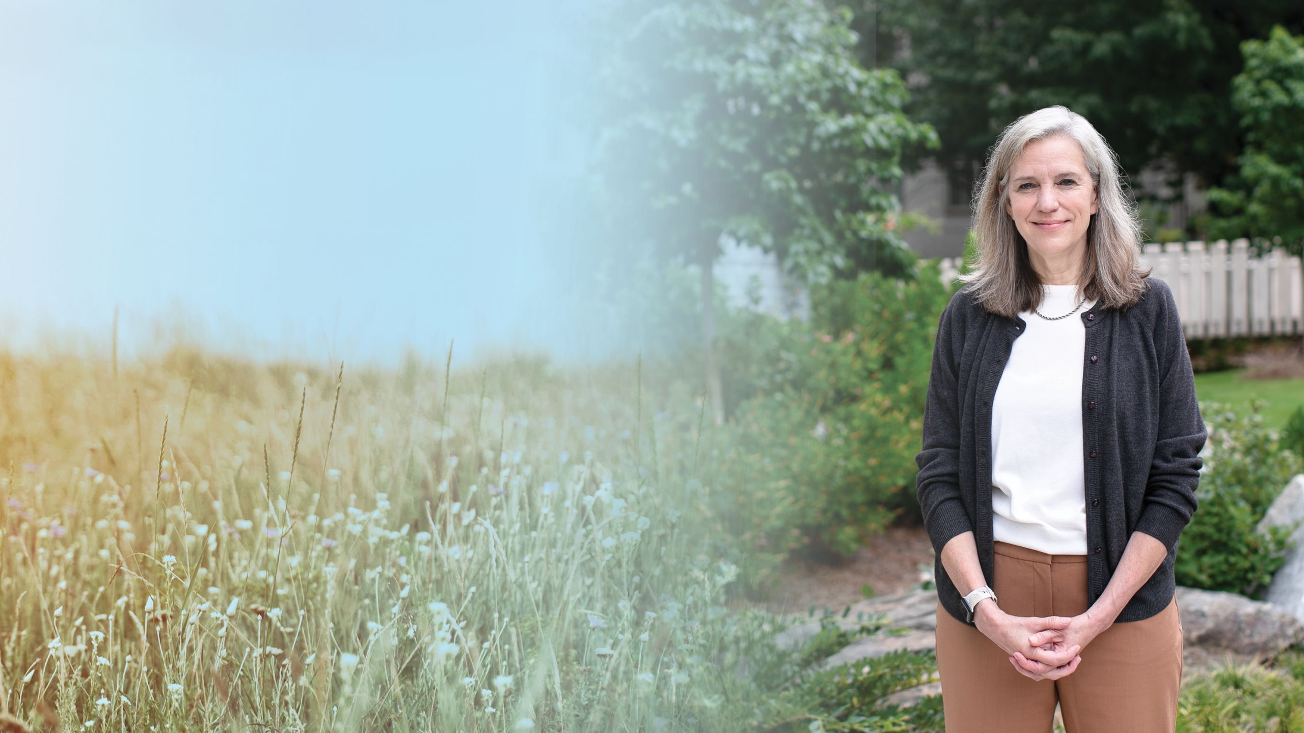 a photo illustration background of a wildflower field on the left and michelle kegler on the right in front of a building with trees with her hands folded in front of her.