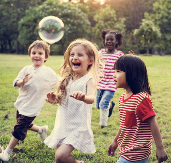 children playing outside in a field