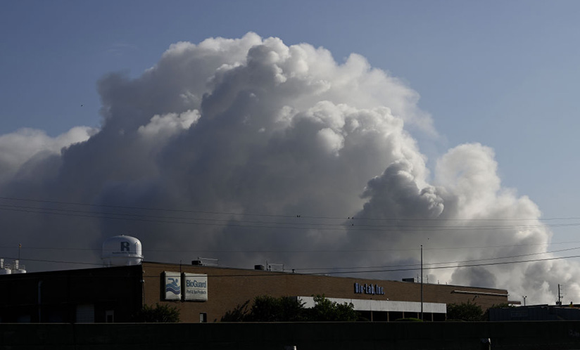 Smoke plume over chemical plant