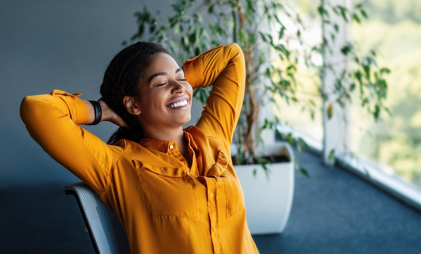 Woman in a yellow sweater relaxing