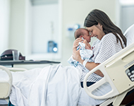 image of a woman holding a baby 