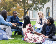 A group of Rollins students sit and chat.