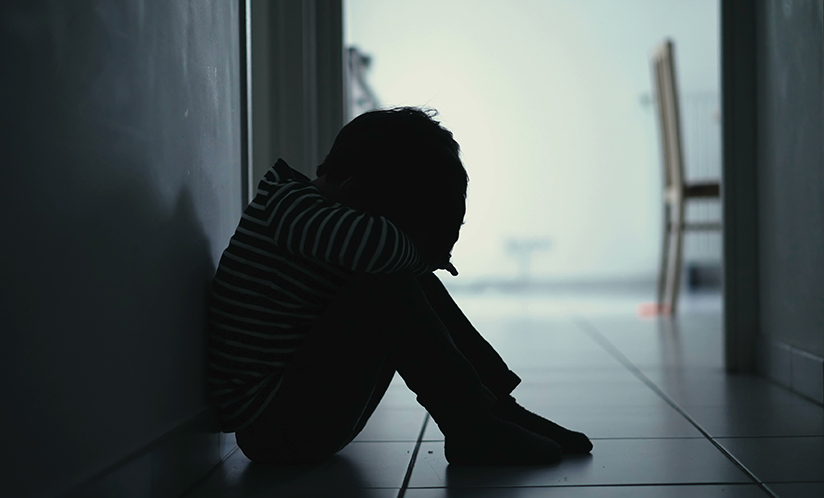 Sad child in hallway
