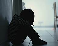 Sad child in hallway