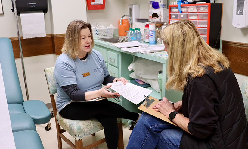 Female researcher surveying study participant