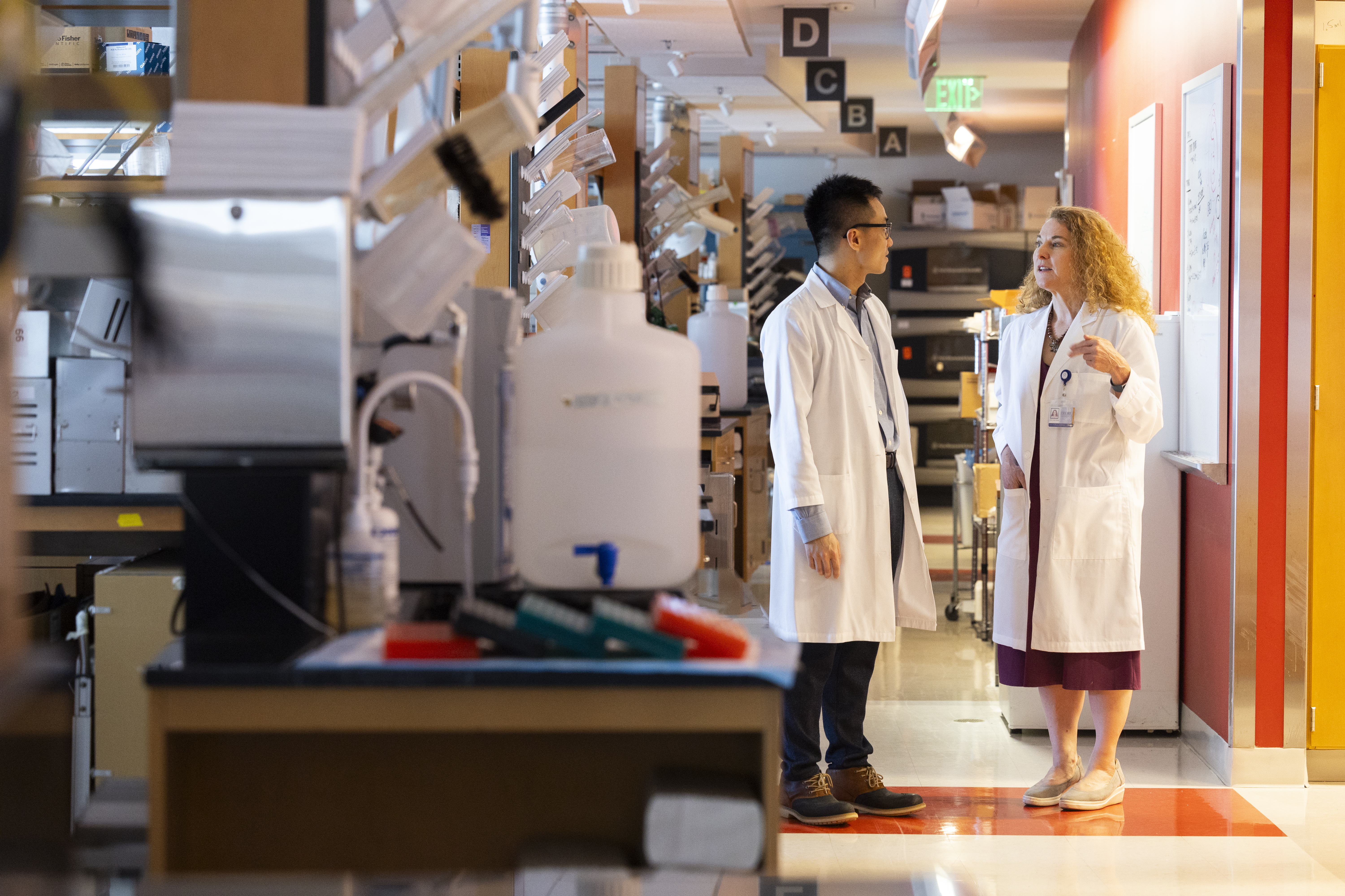 Two Rollins researchers in their lab