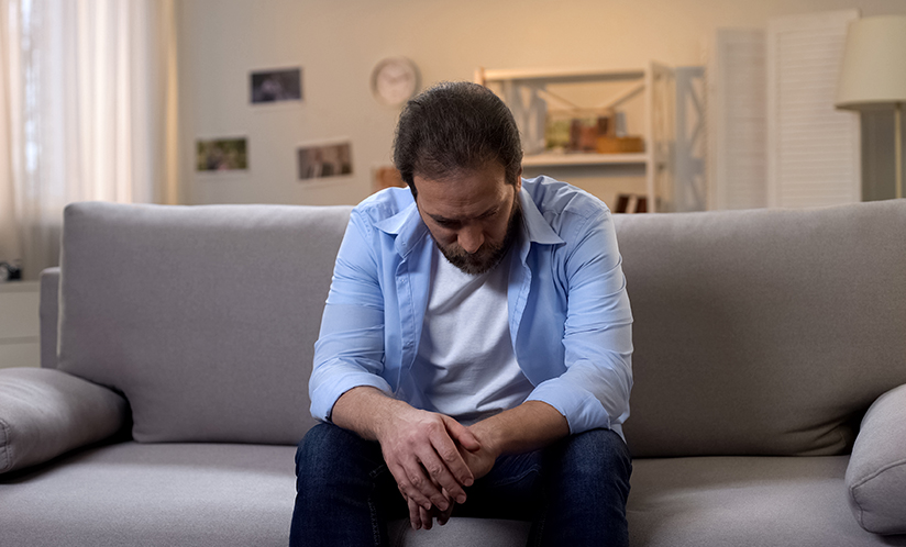 Man alone on couch