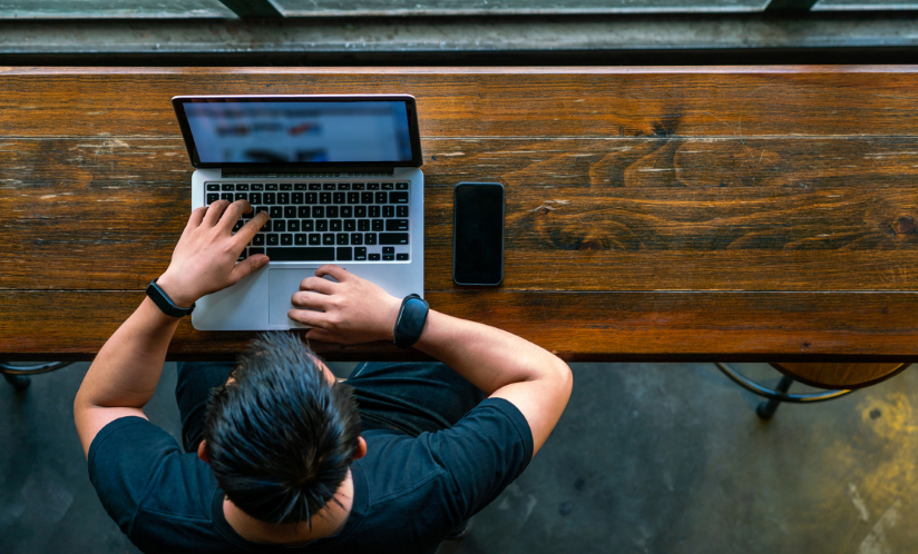 A man at a laptop.