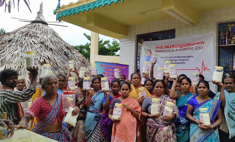 people in India holding up salt