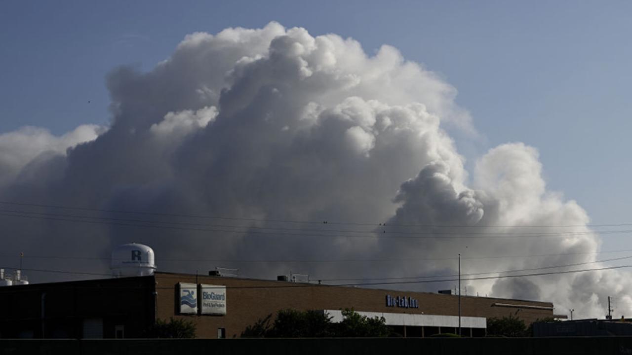 Smoke plume over chemical plant