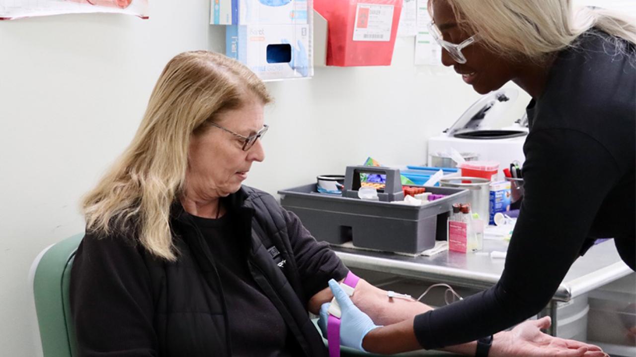 Woman giving blood