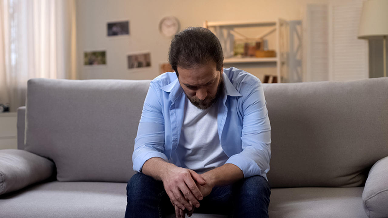 Man alone on couch