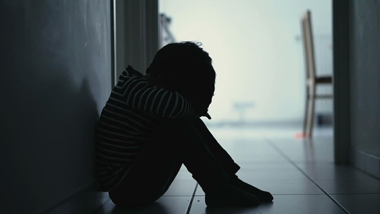 Sad child in hallway