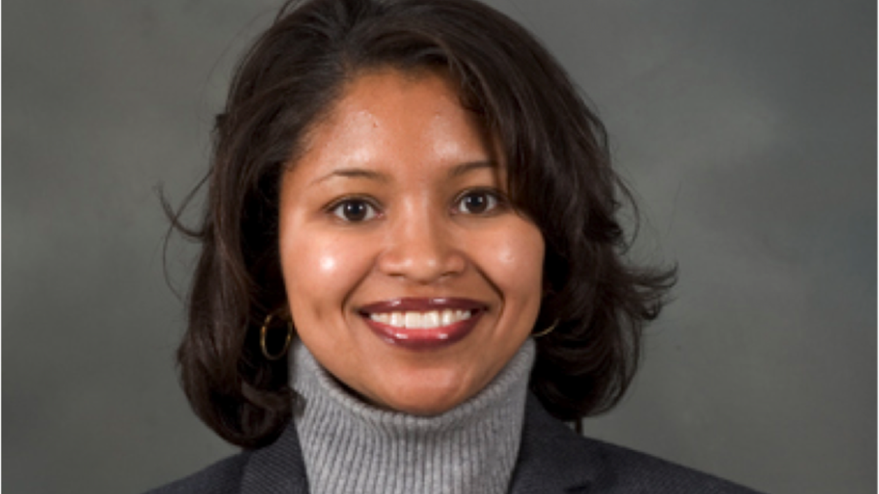 Woman with brown hair smiling