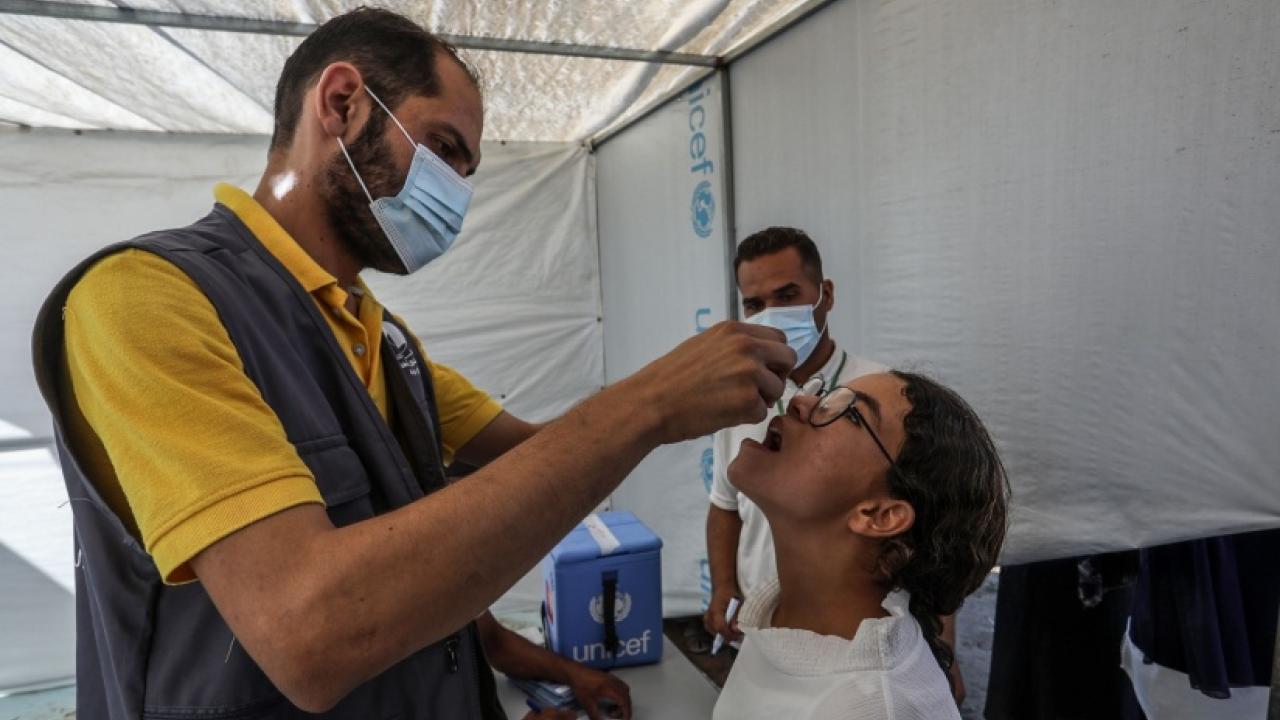A child in Gaza receives a polio vaccination