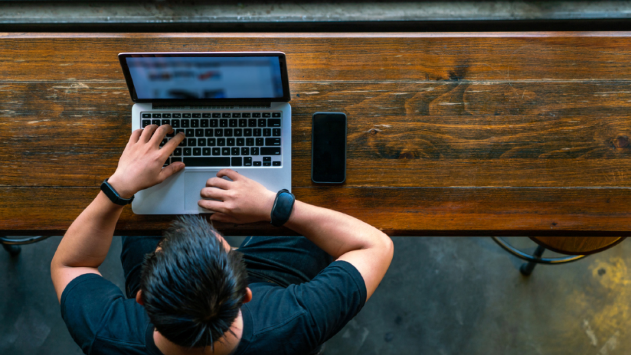 A man at a laptop.