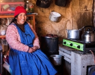 A woman cooks inside her home in Peru. Photo credit: Gates Archive/Omar Lucas Arapa Castro